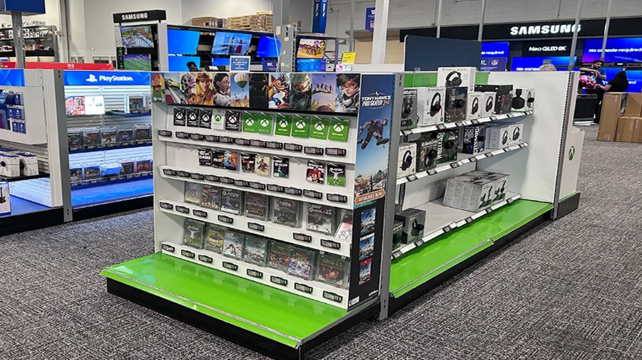 Integrated smart store ecosystem showing electronic shelf labels, self-checkout kiosk display, and shelf-edge LCD digital signage connected through a shared pricing backend